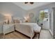 Bright bedroom with a queen bed, nightstands, and a window at 5125 Tidewater Preserve Blvd, Bradenton, FL 34208