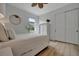 Bright bedroom with a queen bed, nightstands, and a window at 5125 Tidewater Preserve Blvd, Bradenton, FL 34208