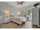 Bright bedroom with a queen bed, nightstands, and a window at 5125 Tidewater Preserve Blvd, Bradenton, FL 34208