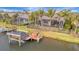 Private boat dock with covered boat lift and a view of the canal at 5125 Tidewater Preserve Blvd, Bradenton, FL 34208