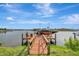 Private boat dock with lift and seating area, perfect for relaxing at 5125 Tidewater Preserve Blvd, Bradenton, FL 34208