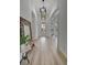 Bright and airy entryway with wood-look floors, leading to backyard view at 5125 Tidewater Preserve Blvd, Bradenton, FL 34208