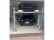 Two-car garage with a car lift system at 5125 Tidewater Preserve Blvd, Bradenton, FL 34208