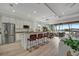 Open concept kitchen with water views from sliding doors at 5125 Tidewater Preserve Blvd, Bradenton, FL 34208