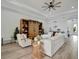 Light and airy living room with a large sectional sofa at 5125 Tidewater Preserve Blvd, Bradenton, FL 34208