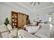 Living area with built-in shelving and casual seating at 5125 Tidewater Preserve Blvd, Bradenton, FL 34208