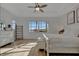 Spacious main bedroom with large window, ceiling fan and white furniture at 5125 Tidewater Preserve Blvd, Bradenton, FL 34208