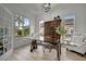 Home office with glass-top desk and built-ins at 5125 Tidewater Preserve Blvd, Bradenton, FL 34208