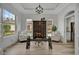 Home office with glass-top desk and built-ins at 5125 Tidewater Preserve Blvd, Bradenton, FL 34208