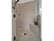 Walk in shower with glass enclosure and tile surround at 5125 Tidewater Preserve Blvd, Bradenton, FL 34208