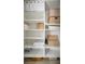 Organized storage closet with shelving for linens and supplies at 5125 Tidewater Preserve Blvd, Bradenton, FL 34208