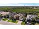 Aerial perspective of three homes, showcasing their placement and curb appeal at 5203 Lake Overlook Ave, Bradenton, FL 34208