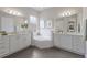 Bathroom with double vanity, soaking tub and separate shower at 5203 Lake Overlook Ave, Bradenton, FL 34208