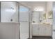 Bathroom with shower, vanity, and neutral decor at 5203 Lake Overlook Ave, Bradenton, FL 34208