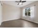Light-filled bedroom featuring tile floors and a window with curtains at 5203 Lake Overlook Ave, Bradenton, FL 34208