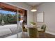 Breakfast nook with glass table and chairs overlooking patio at 5203 Lake Overlook Ave, Bradenton, FL 34208