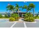 Community clubhouse with palm trees and ample parking at 5203 Lake Overlook Ave, Bradenton, FL 34208