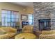 Cozy lounge area with stone fireplace and seating at 5203 Lake Overlook Ave, Bradenton, FL 34208
