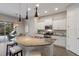 Modern kitchen with island, stainless steel appliances and breakfast nook at 5203 Lake Overlook Ave, Bradenton, FL 34208