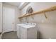 Laundry room with washer, dryer and shelving at 5203 Lake Overlook Ave, Bradenton, FL 34208