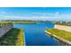 Calm residential canal with lush green landscaping on both sides at 5203 Lake Overlook Ave, Bradenton, FL 34208