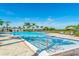 Community pool with ample deck space and lounge chairs at 5203 Lake Overlook Ave, Bradenton, FL 34208