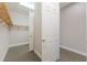 Large walk-in closet with double hanging rods and shelving at 5203 Lake Overlook Ave, Bradenton, FL 34208