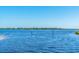 Peaceful waterway view with natural markers and clear blue water at 5203 Lake Overlook Ave, Bradenton, FL 34208