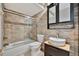 Updated bathroom with stone tile and modern vanity at 5800 Hollywood Blvd # 115, Sarasota, FL 34231