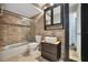 Updated bathroom with stone tile and modern vanity at 5800 Hollywood Blvd # 115, Sarasota, FL 34231