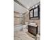 Updated bathroom with stone tile and modern vanity at 5800 Hollywood Blvd # 115, Sarasota, FL 34231