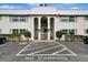 Front view of a condo building with parking at 5800 Hollywood Blvd # 115, Sarasota, FL 34231