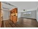 Open concept kitchen and living area with wood flooring at 5800 Hollywood Blvd # 115, Sarasota, FL 34231