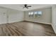 Bright living room with wood-look floors at 5800 Hollywood Blvd # 115, Sarasota, FL 34231