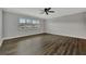 Living room with dark wood floors and ceiling fan at 5800 Hollywood Blvd # 115, Sarasota, FL 34231