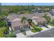 Aerial view of charming villa community with lush landscaping and community pool at 5958 Clubside Dr, Sarasota, FL 34243