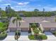 Aerial view of villas with lush landscaping and attractive rooflines at 5958 Clubside Dr, Sarasota, FL 34243