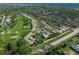 Aerial view of community near golf course and other homes at 5958 Clubside Dr, Sarasota, FL 34243