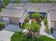 An aerial view showcasing a villa with a private courtyard and lush tropical landscaping at 5958 Clubside Dr, Sarasota, FL 34243