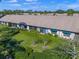 Aerial view showcasing a row of villas with a well-manicured lawn at 5958 Clubside Dr, Sarasota, FL 34243