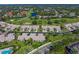 Wide aerial view of community near golf course with pool at 5958 Clubside Dr, Sarasota, FL 34243