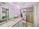 Bright bathroom with granite countertops, walk-in shower, and updated fixtures at 5958 Clubside Dr, Sarasota, FL 34243