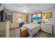 Bedroom with built-in desk, ample storage, and coastal decor at 5958 Clubside Dr, Sarasota, FL 34243
