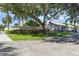 Clubside community entrance with paved road and landscaping at 5958 Clubside Dr, Sarasota, FL 34243