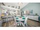 Charming dining area with white table and chairs, adjacent to kitchen at 5958 Clubside Dr, Sarasota, FL 34243