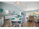Open dining area with a round table and chairs, overlooking living room at 5958 Clubside Dr, Sarasota, FL 34243