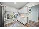 Bright kitchen boasts white cabinets and a large window overlooking the backyard at 5958 Clubside Dr, Sarasota, FL 34243