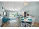 Spacious living room with hardwood floors, a comfy sofa, and access to patio at 5958 Clubside Dr, Sarasota, FL 34243