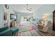 Relaxing living room features hardwood floors, large windows and comfy seating at 5958 Clubside Dr, Sarasota, FL 34243