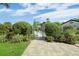 Pathway to community pool area with lush landscaping at 5958 Clubside Dr, Sarasota, FL 34243
